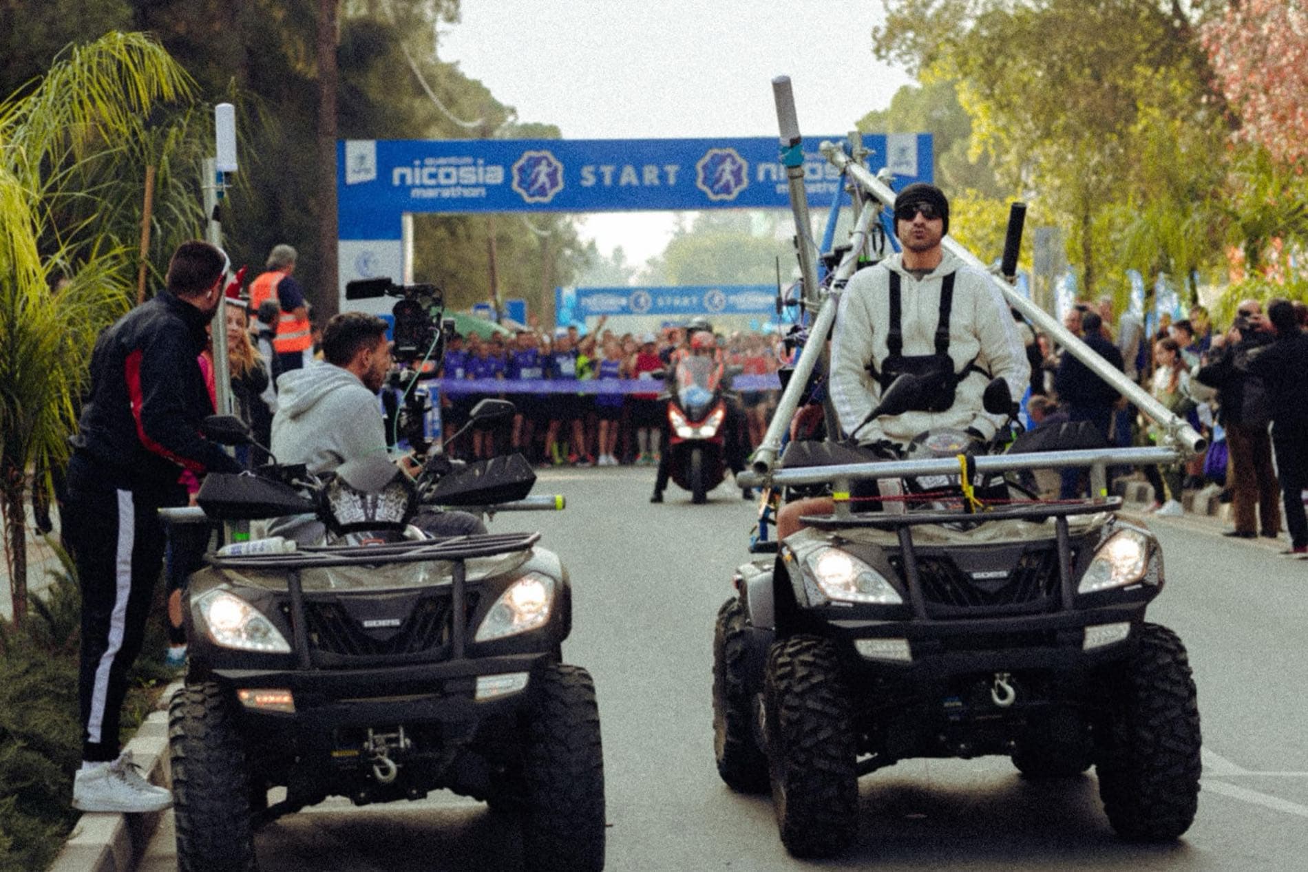 Backlight Media camera operators on custom quad-bike gimbal rigs at the start of the Quantum Nicosia Marathon, live broadcast to Cyprus national TV RIK1