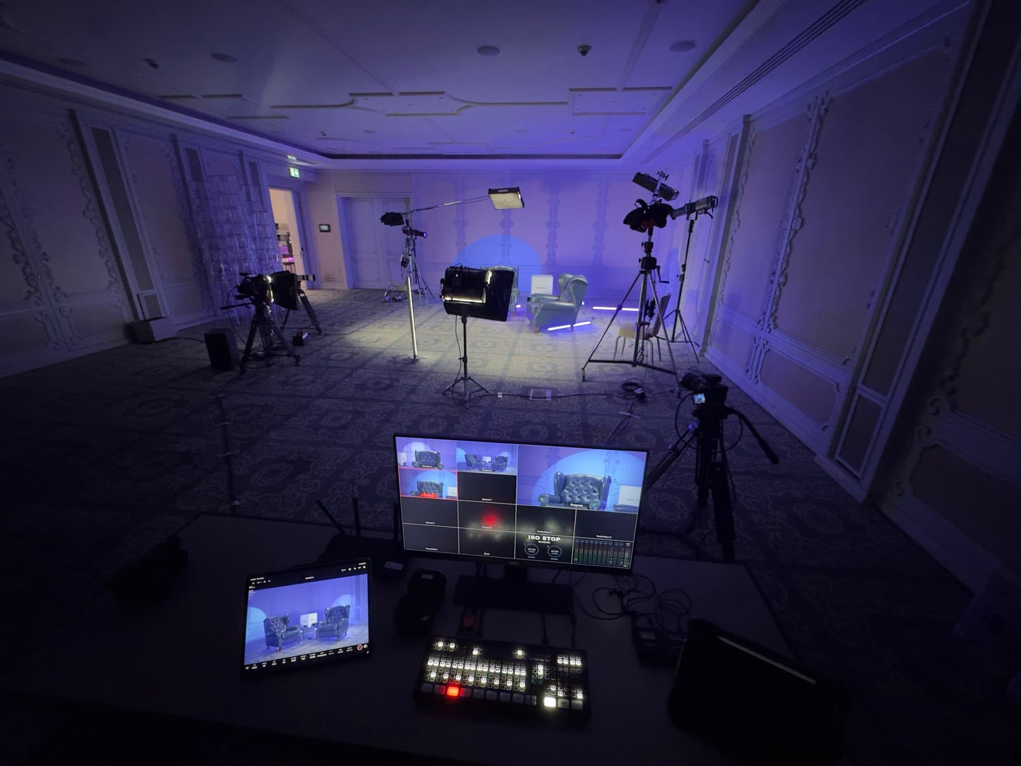 Backlight Media vision control position in the main room at the Chrisons Cloud Tech Expo, Cyprus, with control desk and tripod cameras
