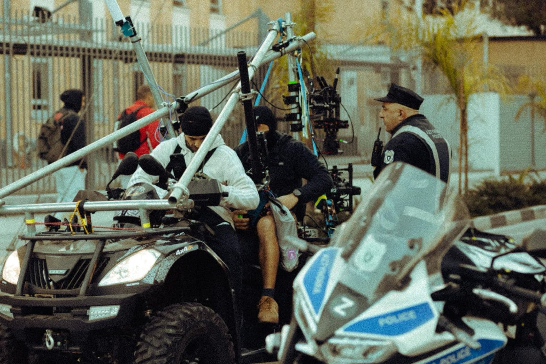 A Backlight Media camera quad-bike alongside a police escort motorbike on the Quantum Nicosia Marathon route, Cyprus