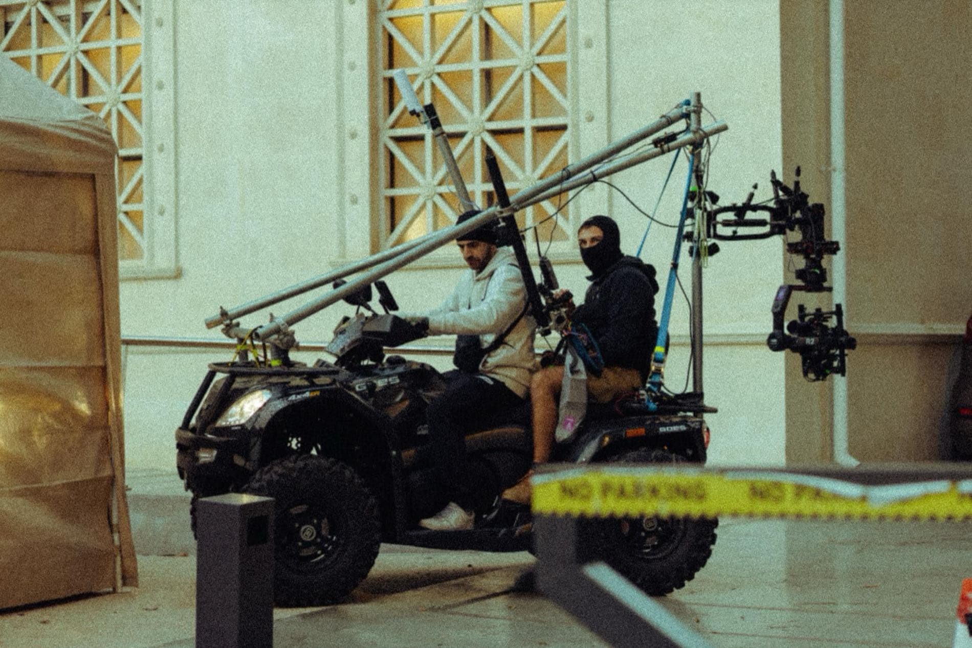 A Backlight Media operator drives a quad-bike carrying a tall crane-arm camera rig for the Quantum Nicosia Marathon live broadcast, Nicosia