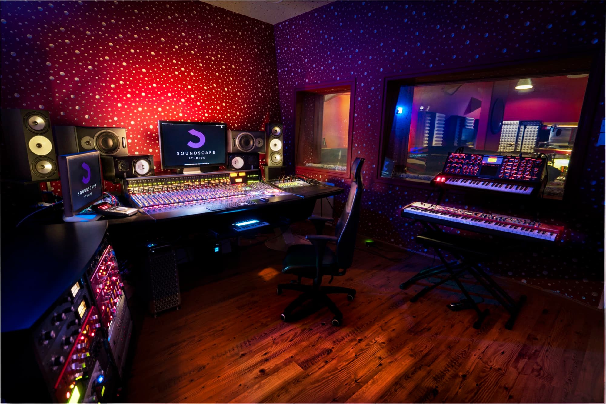The Soundscape Studios control room from the side, showing the console, engineer chair and outboard gear, shot by Backlight Media