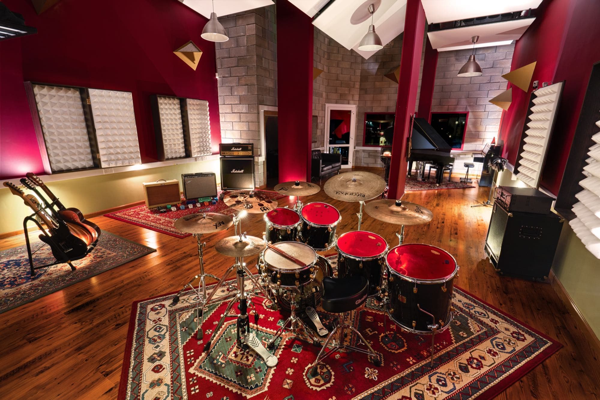 The drum kit and instruments in the live room at Soundscape Studios, shot by Backlight Media