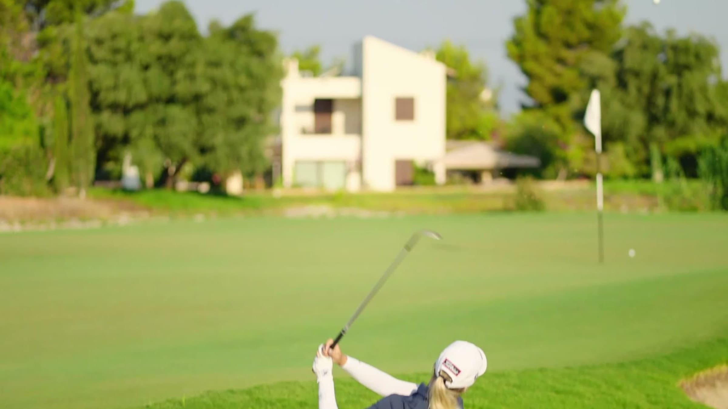Steph Kyriacou playing an approach shot at Aphrodite Hills, from the Backlight Media film